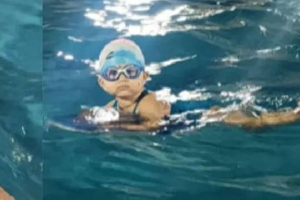 Veda Sarfare youngest swimmer, 1 year 9 months swimmer, India Book of Records swimming, Ratnagiri child swimmer, Veda 100 meter swimming record, toddler swimming achievement, youngest Indian swimmer record, Veda Sarfare swimming video, inspiring child swimmer India, early age swimming prodigy