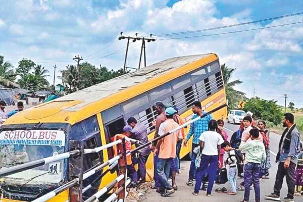 school bus accident in nhavare: bus falls into deep drain, 10 to 15 students rescued safely